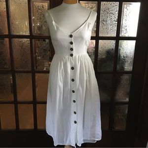 100% cotton fit and flare ruffle hem dress with shirred back